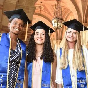 three smiling UCLA Extension graduates
